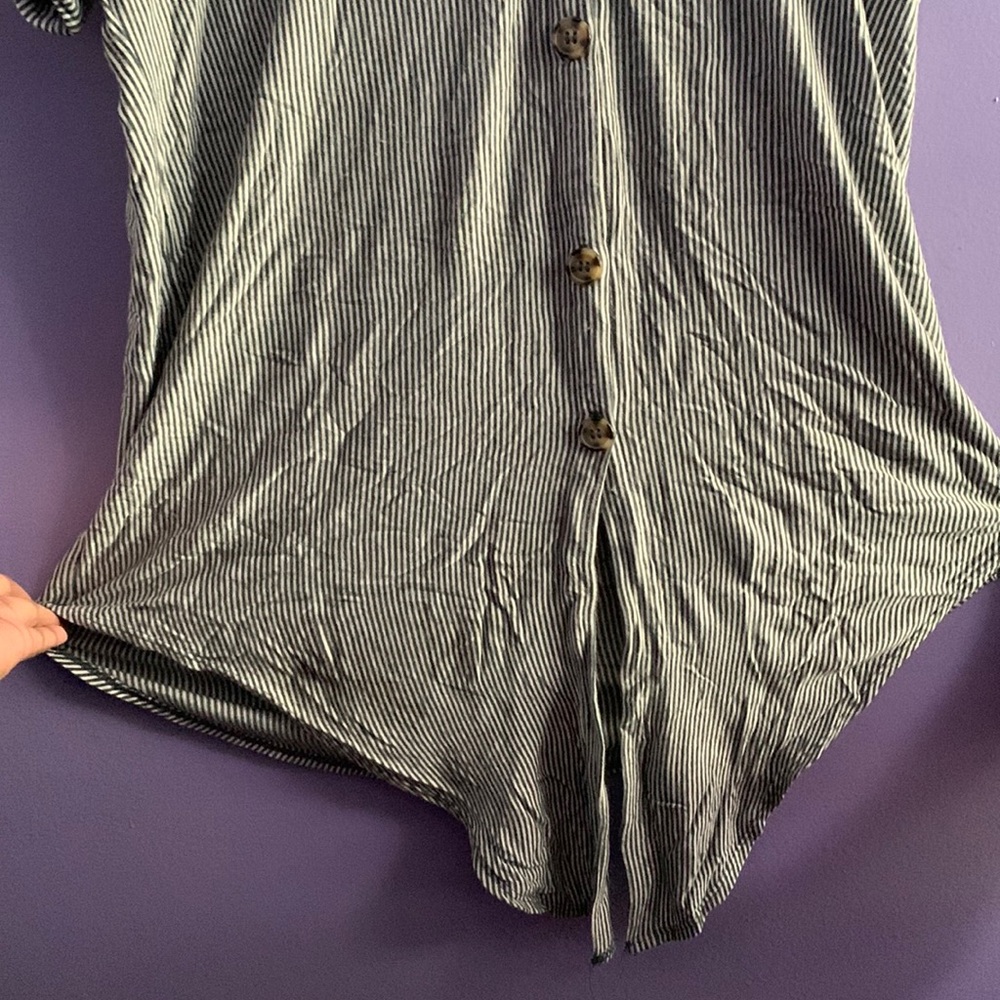 Casual/ Business Casual button up shirt with tie at the  bottom.